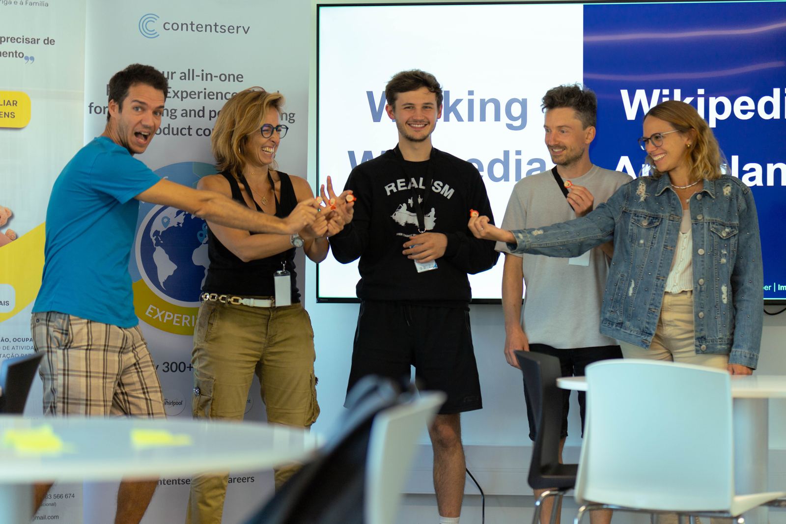 A hackathon team celebrating on stage